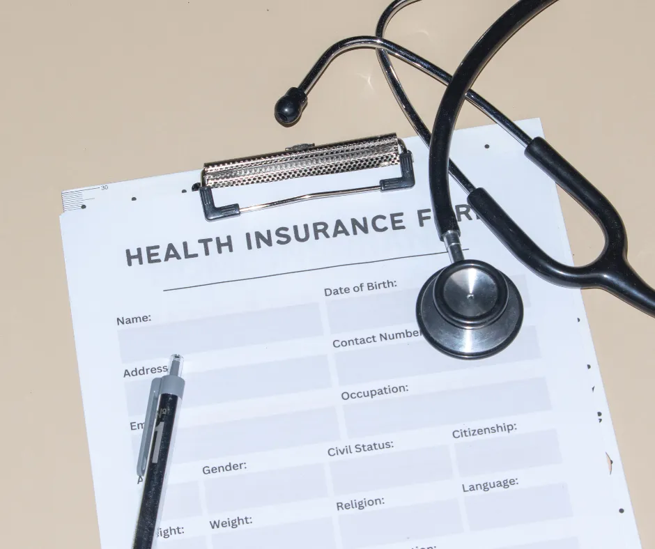 Health coverage materials on a desk.